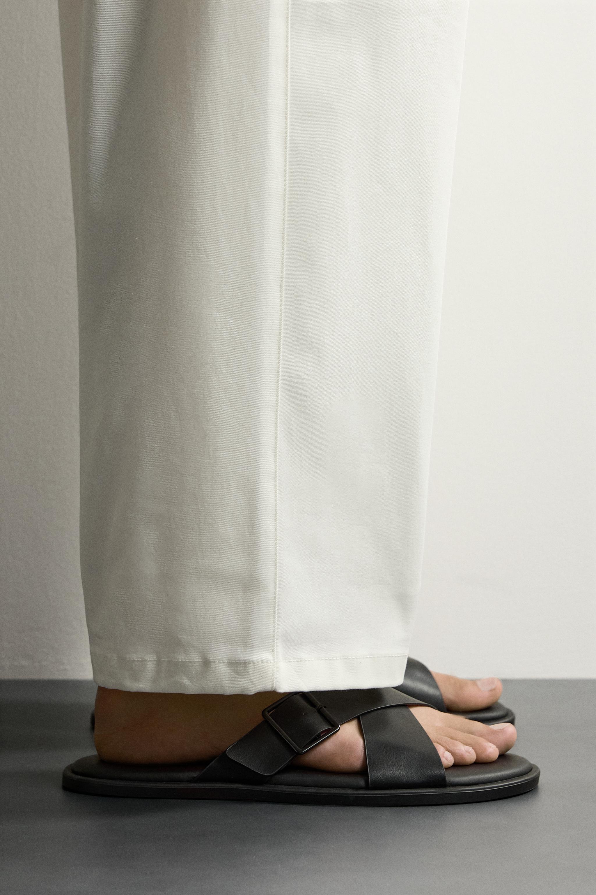 BUCKLED CRISSCROSS SANDALS